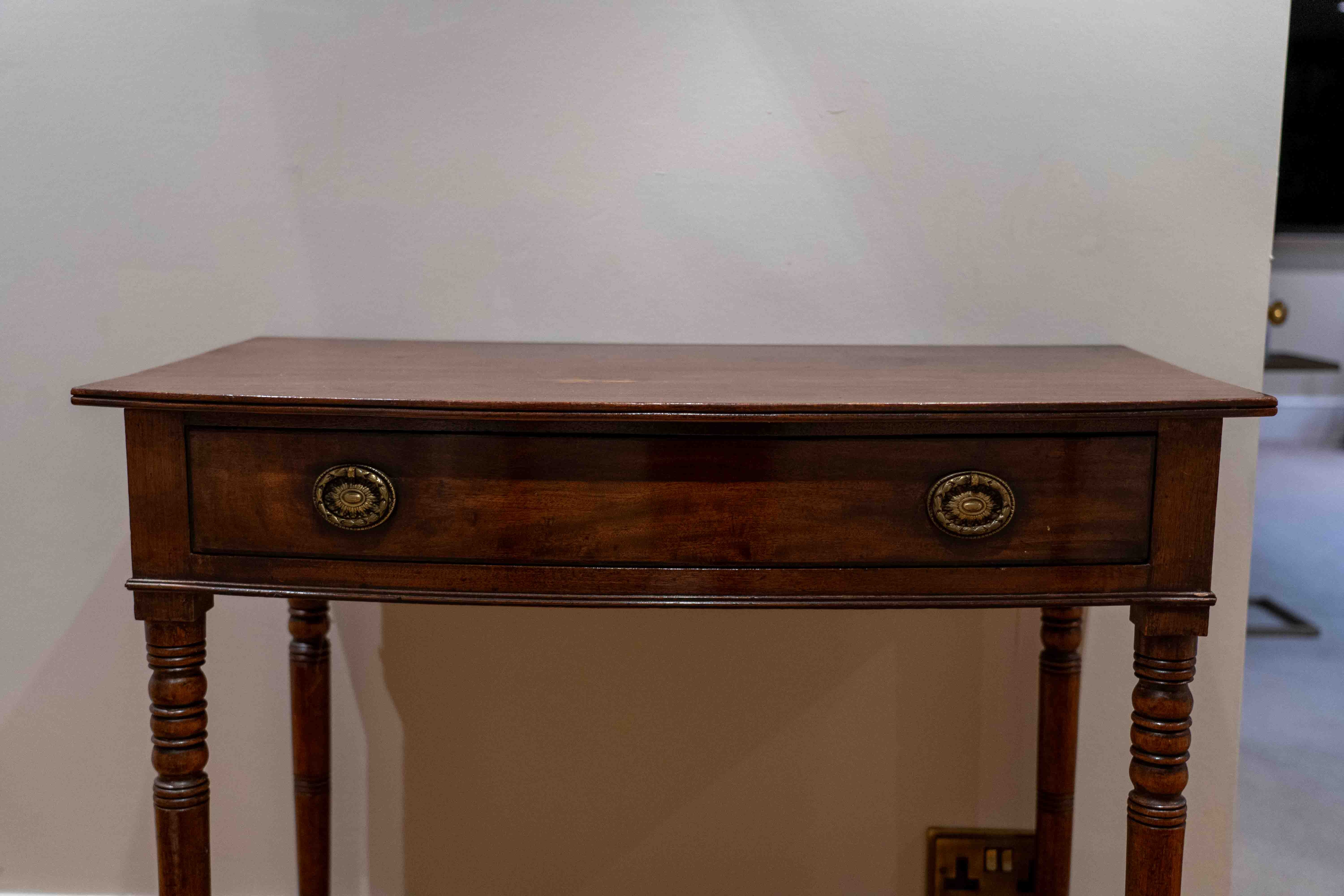 A Regency mahogany bow front side table, width 91cm, depth 53cm, height 81cm. Condition - fair